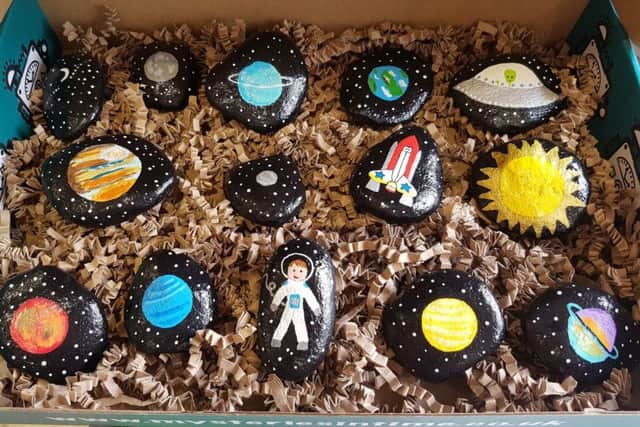 The astronaut story stone rocks take Donna about one day to paint and can be bought for 10 - with all proceeds split between two local causes.