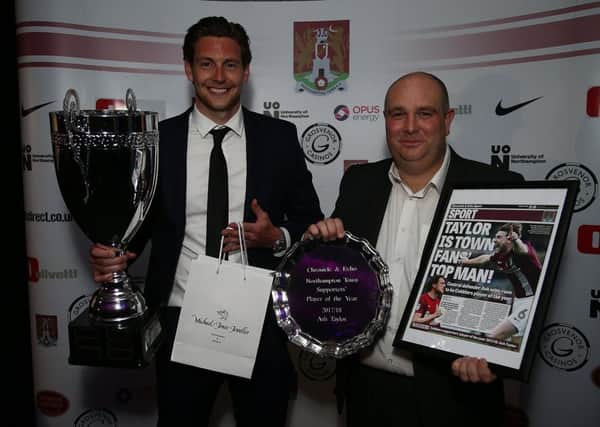 Ash Taylor is pictured with his prizes after claiming the Chronicle & Echo Cobblers supporters' player of the year award on Sunday night. Taylor is pictured with Tom Jennings of sponsors Grosvenor Casino (Picture: Pete Norton)