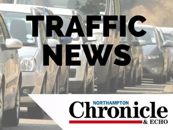 A motorbike and a car have been involved in a crash on the M1 near Northampton.
