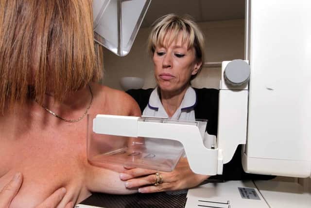 Breast Screening radiographer Heather Verlander, pictured with a patient in 2010. Recent reports have revealed a number of women did not receive screening reminders in 2009 after an NHS IT fault.