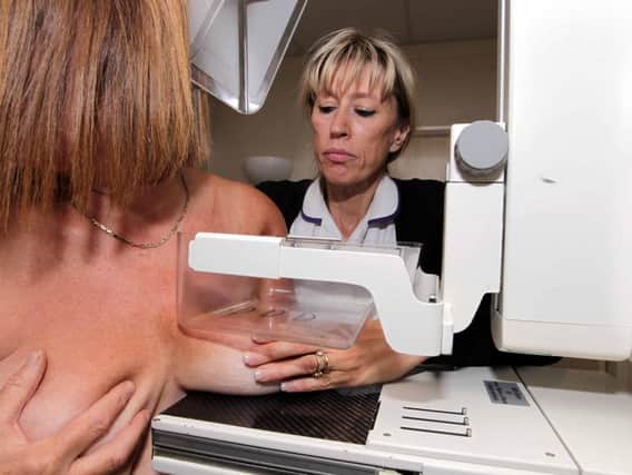 Breast Screening radiographer Heather Verlander, pictured with a patient in 2010. Recent reports have revealed a number of women did not receive screening reminders in 2009 after an NHS IT fault.