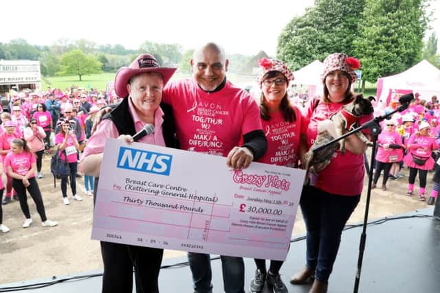 Glennis Hooper handing over a cheque for £30,000 to KGH