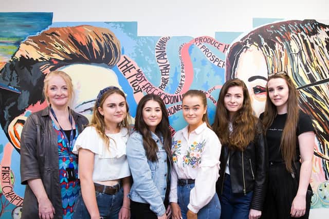 Moulton College students with Opus Energys Nikki Flanders (left) and Kacie Fay (right) in front of honesty mural. (Picture: Kirsty Edmonds)