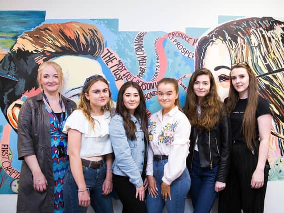 Moulton College students with Opus Energys Nikki Flanders (left) and Kacie Fay (right) in front of honesty mural. (Picture: Kirsty Edmonds)