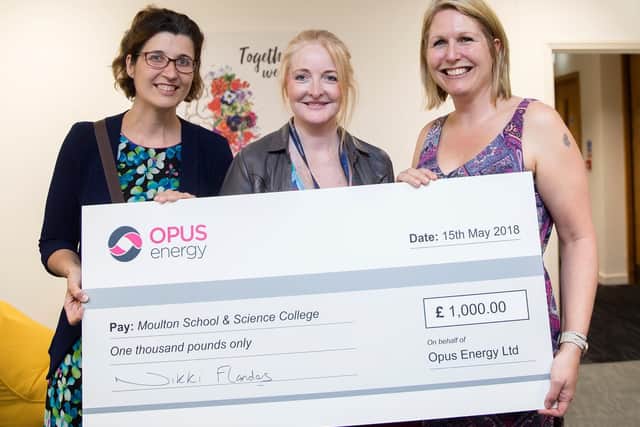 Opus COO presents Moulton College with cheque as thank you for involvement with mural project. (Picture: Kirsty Edmonds)