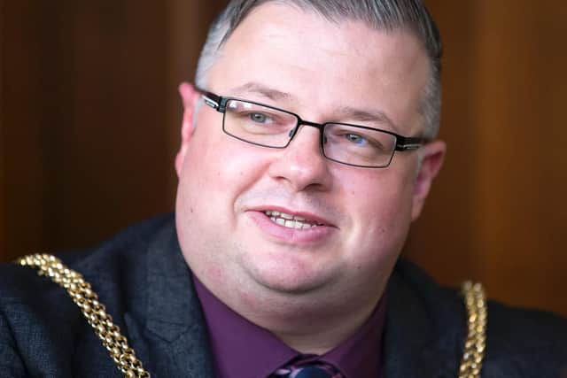 Gareth Eales hands over his chains as the Mayor of Northampton tonight.