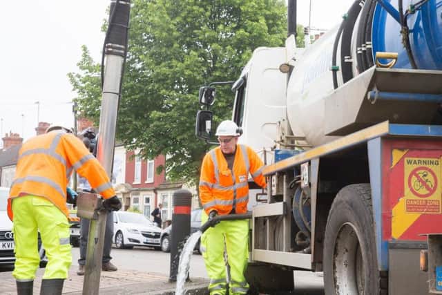 Contractors work to clean St Leonard's drains. Many residents say the drains in the area were blocked when the rains hit.