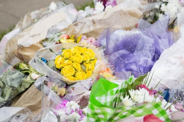 Floral tributes have been left at the scene.
