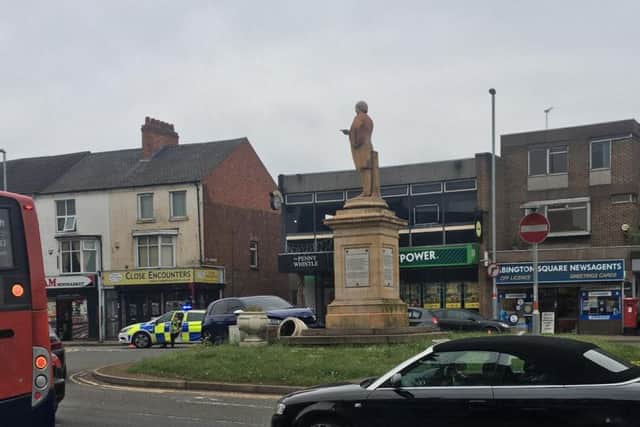 The blue VW Golf hit one of the flower pots at the base of the statue