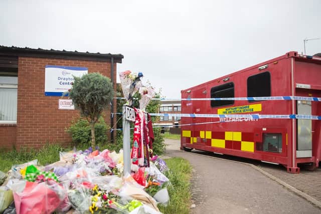 Flowers have been gathering at the scene of the murder in Drayton Walk this week.