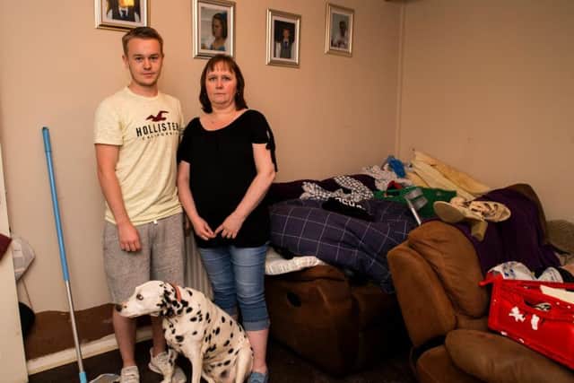 Daniel and Kim Powell are counting the cost of damage in East Hunsbury after their home was destroyed for the second time as a result of water damage. Here they are pictured with their Dalmatian, Bella.