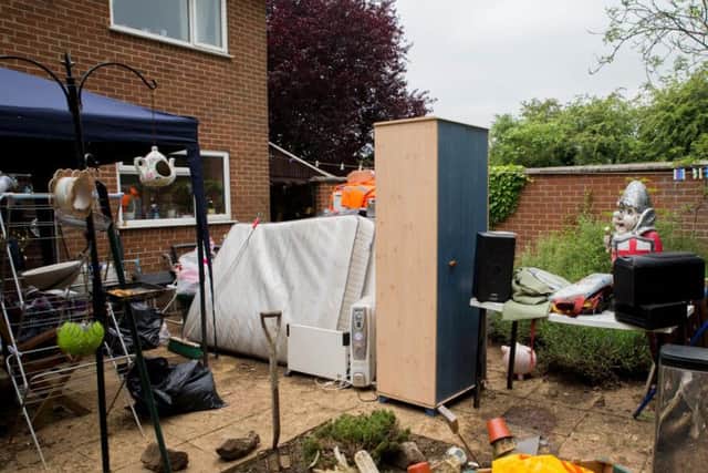 The Powell's lean-to was damaged in the flooding along with their white good, which was stored in there, and Daniel's bedding.