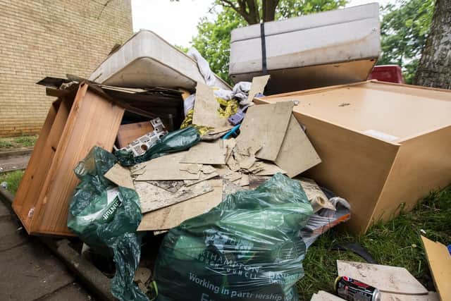 Mattresses and cabinets were slung out yesterday at the end of the row of houses.