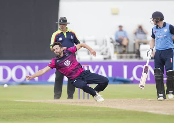 Ben Sanderson attempts to field a ball off his own bowling in the defeat to Derbyshire (PIctures: Kirsty Edmonds)