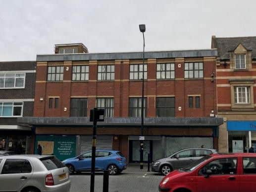 The existing building (middle) currently stands empty.