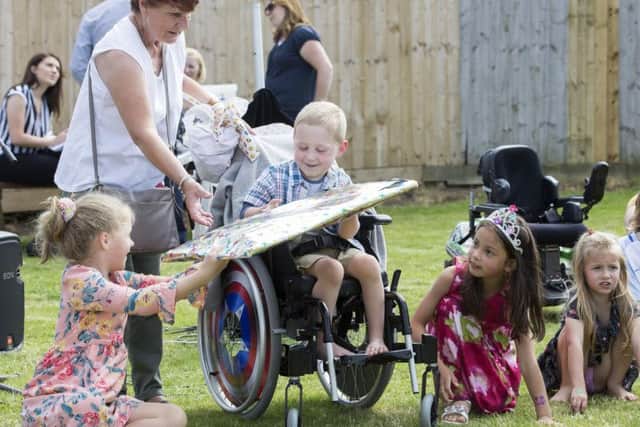 Harry enjoying pass the parcel with his school friends at his fun day on Saturday. Pictures: Kirsty Edmonds.