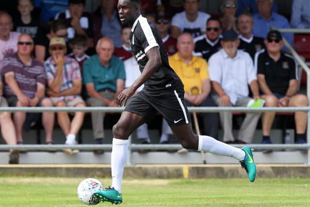 Cobblers central defender Leon Barnett