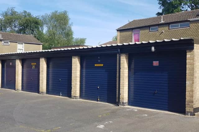 The campaign group says this row of garages has just been "refurbished" by NPH They claim the revamp is a waste of tax payers money if they are going to be knocked down.