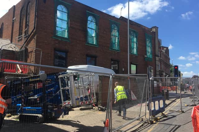 Railings have been put around the second-hand shop.