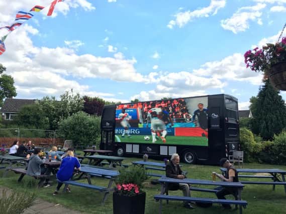 The Spinney Hill pub has hired out a gigantic TV screen