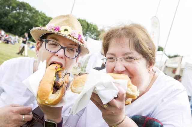 Lynda Furness and Elaine Rymill were among those enjoying Northampton Old Scouts Sausage and Cider Festival this weekend. Pictures by Kirsty Edmonds. NNL-180624-134811009