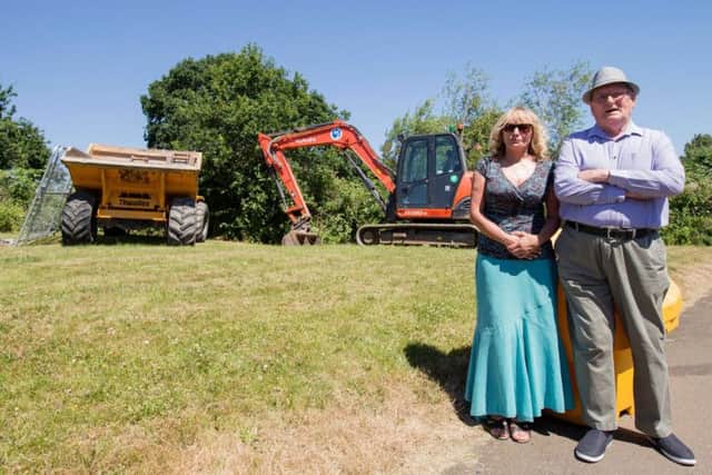Bulldozers and diggers turned up yesterday (Monday, June 25) on land near Lancaster Way. (Pictured Cllr Davenport and Alec Brit).