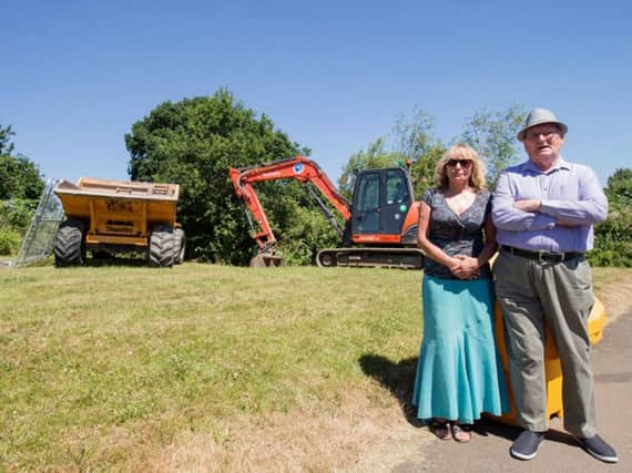 Bulldozers and diggers turned up yesterday (Monday, June 25) on land near Lancaster Way. (Pictured Cllr Davenport and Alec Brit).