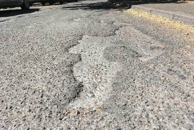 just some of the potholes in Exeter Place.