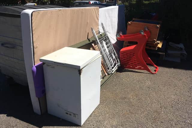 Fly-tippers are regularly dumping waste by the communal bins on the street.