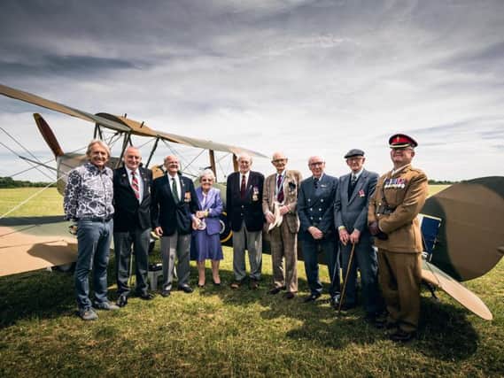 Pictured L-R: Le Mans 'legend' Derek Bell MBE, vice chair - Gary Schiltz, WW2 Veterans - Dennis Wells, Joan Wells, Maurice Marriott, Martin Calvert, Eddie Habberley, Ted Barker and chaperone Major Philip Linehan VR REME, the Second in Command of 103 Battalion REME'. Copyright: Malcolm Griffiths.