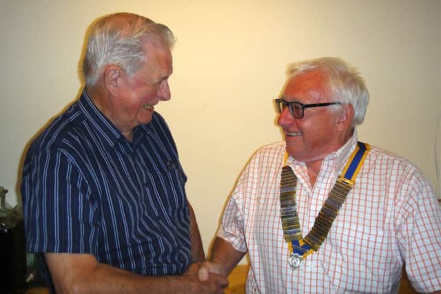Outgoing Brackley Rotary Club president Ken Smith, handing over to new president Colin Gillies. NNL-180307-094933001