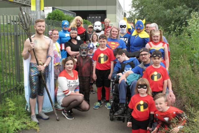 Superhero and villains dressed up to raise funds for Lewis earlier this month.