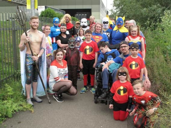 Superhero and villains dressed up to raise funds for Lewis earlier this month.