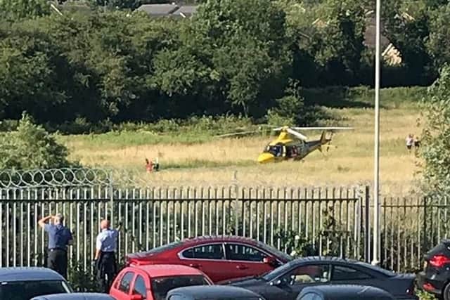 The air ambulance landing at the scene