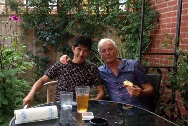 Paul and his former foster son Aziz, who is now 18.