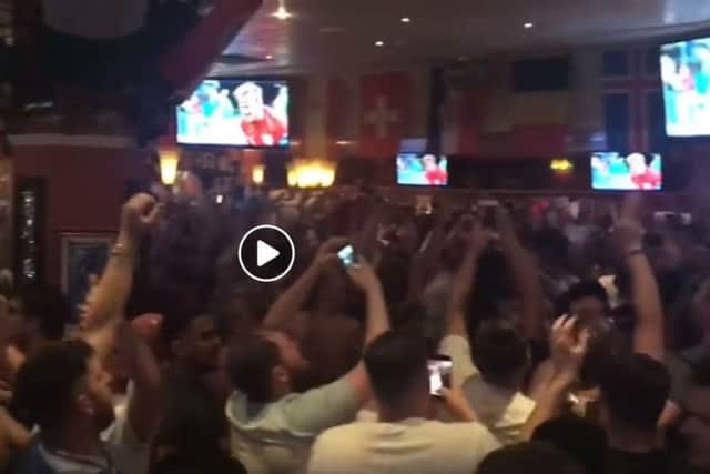 Fans at Barratts in Northampton go crazy as England go through to the quarter finals of the World Cup