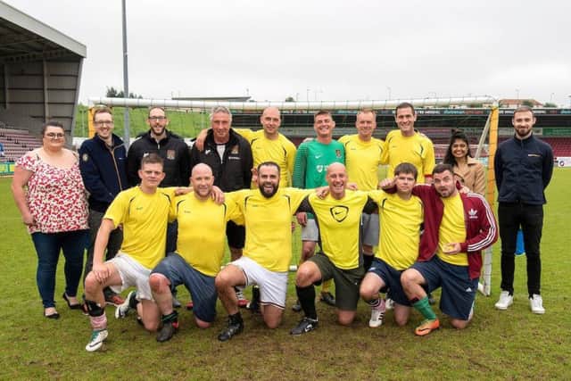 PHOTOGRAPH BY RICHARD GRANGE / UNP (United National Photographers).
30 MAY 1028. NORTHAMPTON TOWN FOOTBALL CLUB, SIXFIELDS STADIUM, NORTHAMPTON. NN5 5QA
Amazon donates £1000 to Northampton Town FC Community Trust to support their 'Heads Up' Festival. Associates from Amazon pay a visit to the festival which had to be scaled down following a bout of heavy rain in the previous days that water-logged the pitch.
The winners of the festival were team Recovery House from Northampton. Pictured with the team here are members of Northampton Town FC Community Trust and Amazon Associates. (l-r back row) Joana Jones - Amazon (Jonejoan), Matt Bainborough - Amazon (MBainbor), Phil Smith - Chief Executive, NTFC Community Trust and Russell Lewis - NTFC Disability Officer.
Moving on to the far right there Amaon Associates Laxmipriya Patel - (Laxmiprp) and Ovidiu Florea (Floreaof) NNL-180507-101424001
