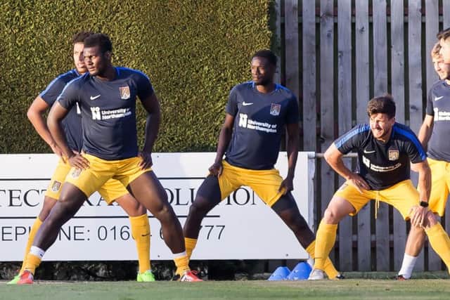 Aaron Pierre warms up with his team-mates at Sileby