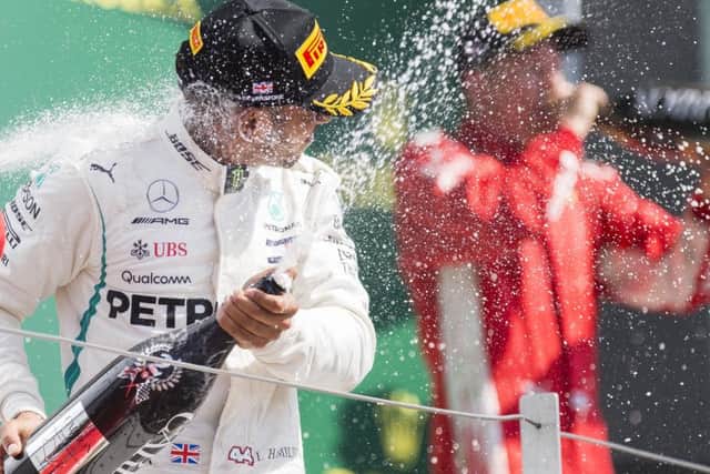 Lewis Hamilton roared back from 18th to claim a podium finish behind Sebastian Vettel
