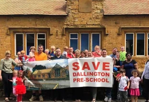 Parents and children pictured outside Dallington Pre-school back in June.