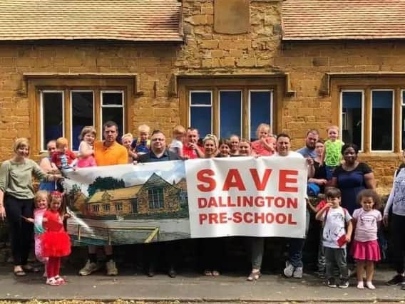 Parents and children pictured outside Dallington Pre-school back in June.