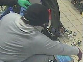 They threatened staff and customers with a crowbar before stealing cigarettes.