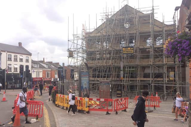 The burnt out building in Abington Street is now held up with "excessive scaffolding."