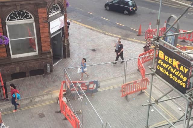 One business owner is concerned that fire engines and ambulances will not be able to access Abington Street with the scaffolding in place.
