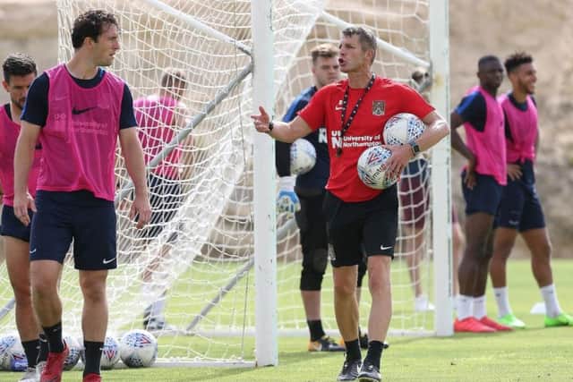 Cobblers boss Dean Austin, seen here dishing out instructions to his playeres in Alicante, has plenty of attacking optons (Picture: Pete Norton)