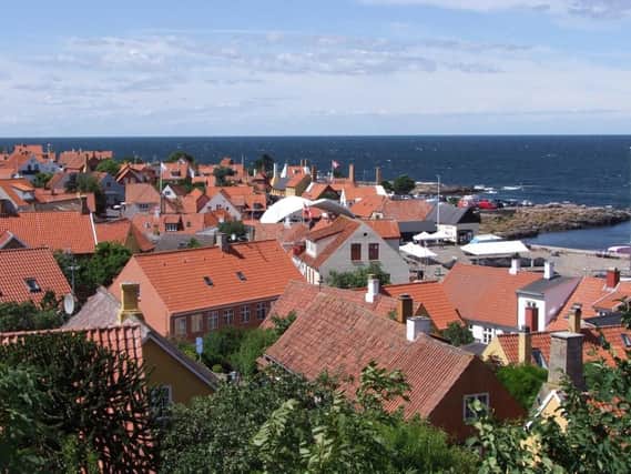 The picturesque red-tiled roofs of Gudhjem is home to Denmark's annual 'Sol Over Gudhjem' cookery competition and its week long food festival.