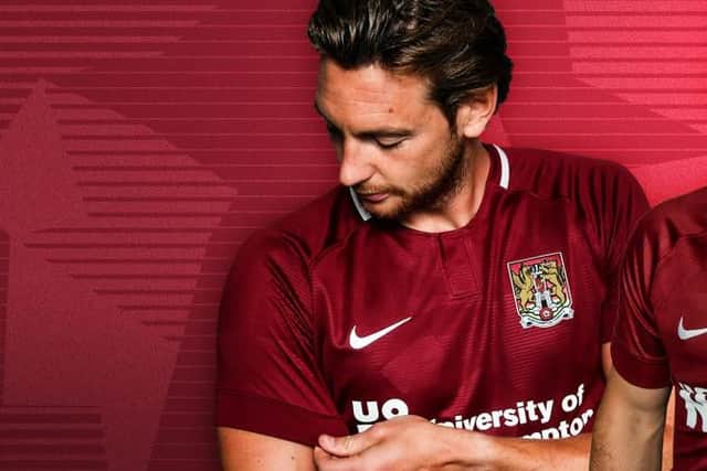 Ash Taylor shows off the new Cobblers home kit