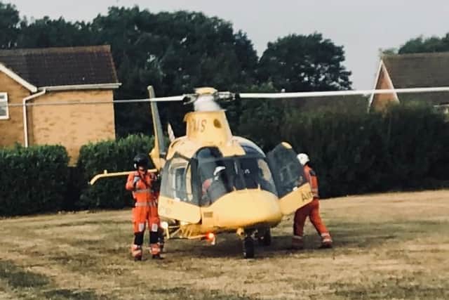 An air ambulance was called to Boughton Green Road after a cyclist sustained a life-threatening injury.