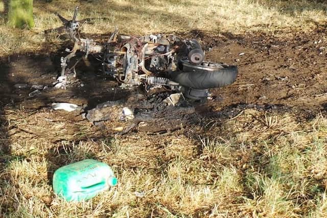The remains of a burnt out moped and a petrol can have been spotted on a Northampton park.