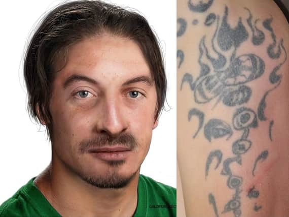 An artists impression of the man found dead in Leicester as well as a distinctive tattoo he had has been released by police.